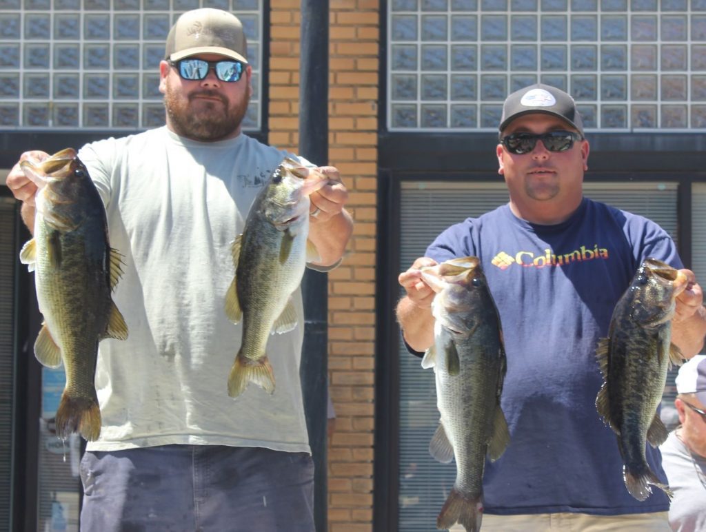 Anglers show off their fish after the weigh-in at last year’s Johnston Peach Blossom Festival Bass Fishing Tournament.